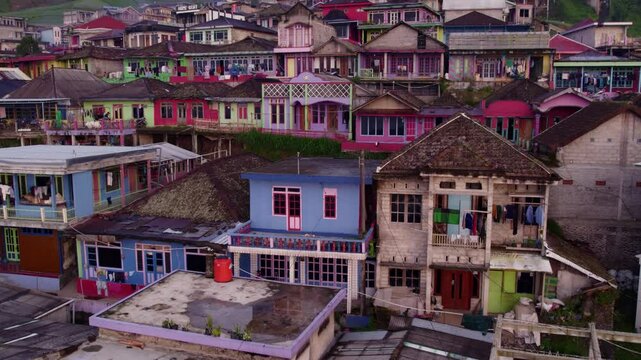 Aerial view of colorful houses on hillside with mosque in Nepal van Java, Magelang City, Indonesia.