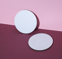 Coasters, white round mockups on pink burgundy background