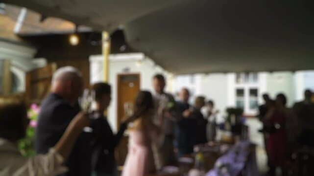 the wedding banquet. the wedding feast. the guests congratulate the young people. wedding event. blur
