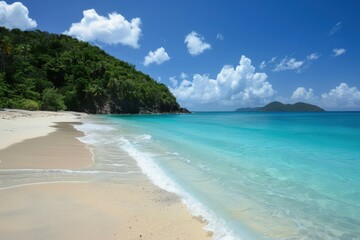 a sandy beach with clear blue water and a mountain in the background