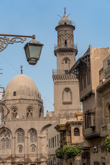 The iconic domes and minarets of the historical buildings in Islamic Cairo along Muiz street near Khan el Khalili Bazaar, Cairo, Egypt.