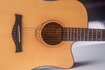 guitar from light wood on a whith background. 