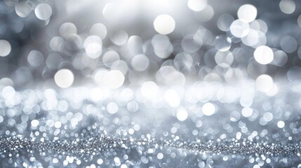 Abstract background with silver and white bokeh lights