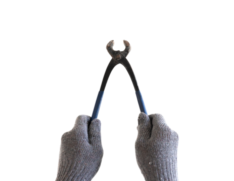 Hand holding old pliers with open ends on isolated background