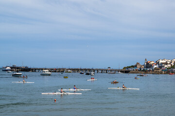 Obraz premium People in kayaks on Swanage Bay, Swanage, Dorset, England