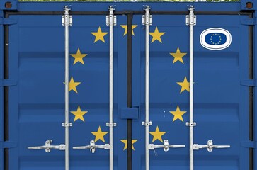 European union flag depicted on metal doors of shipping cargo container outdoors in docks area...