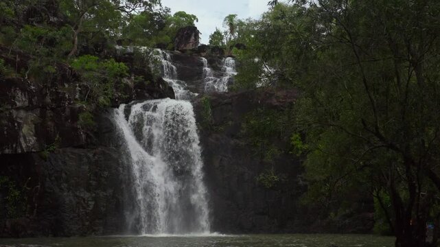 Cedar Creek Falls Whitsundays Airlie Beach Proserpine Waterfall slow motion river Australia reserve Palm Grove QLD Queensland Rainy wet season spring summer autumn winter sunny blue sky clouds pan