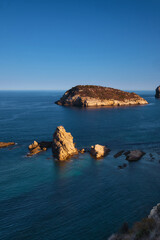 rocky bay calm blue sea