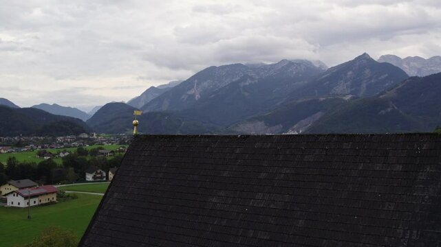 Aerial view of Wallfahrtskirche, town, and mountain in autumn, Golling an der Salzach, Salzburg, Austria.