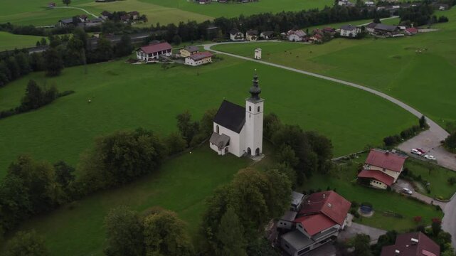 Aerial view of Wallfahrtskirche church, town, and mountain in autumn, Golling an der Salzach, Salzburg, Austria.