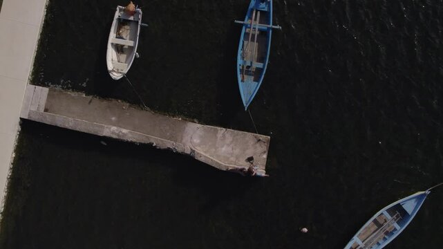 Aerial view of tranquil harbour with boats and dock, Nin, Croatia.