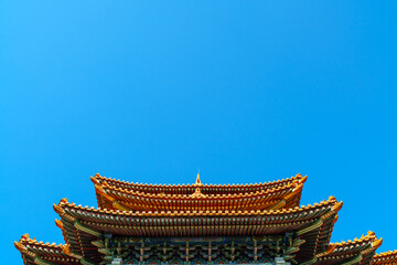 Obraz premium Decoration Details of Yanchi Tower in Forbidden City under sun and blue sky