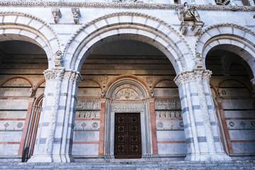 Entrance and facade of Cathedral of Saint Martin, Lucca, Tuscany, Italy