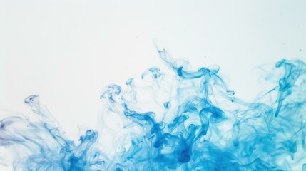 Fototapeta premium Abstract image of blue ink swirls forming organic shapes in water, creating a dynamic and fluid background.