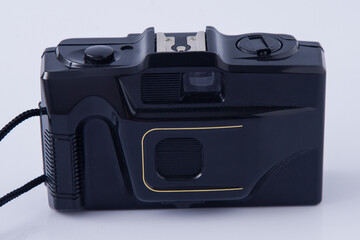 Old film plastic camera on white background.
