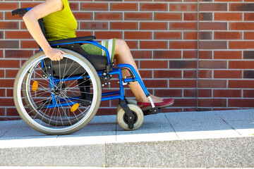 woman on wheelchair entering the platform