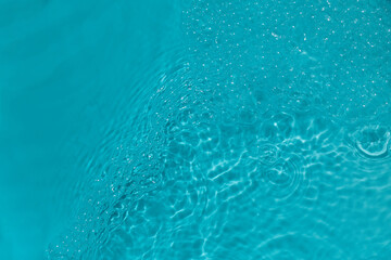 Serene Aquatic Ripples Close-up of bubbles in bright turquoise water.