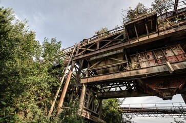 Former Sand Gravel Quarry on the Abandoned Industrial Site. Metal Constructions. Rusted Metal. Wallpaper. Background