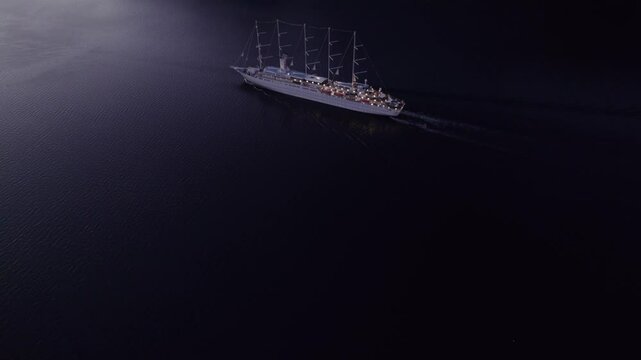 Aerial view of tranquil Kotor Bay at dawn with cruise ship MSY Wind Surf, Montenegro.