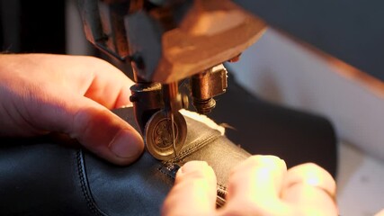 male craftsman makes stylish footwear or repair
