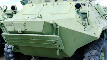 Close-Up of Military Armored Vehicle. A close-up view of a military armored vehicle showcasing its rugged design and exterior details, suitable for defense and combat scenarios.