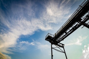 Skyward Path Low Angle View of Industrial Walkway in Gravel Quarry. Walkway to the Clouds Industrial Path in Gravel Carrier. Wallpaper, Background.