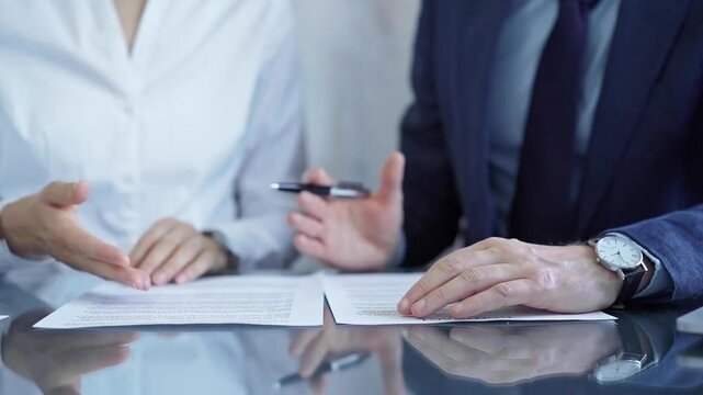 Business people having meeting discussing contract details. Diverse group team, close up