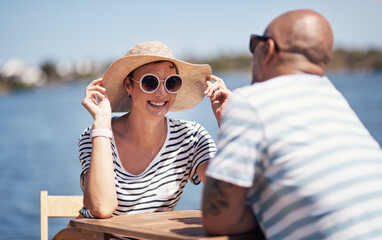 Couple, smile and travel with happy conversation at harbor, vacation or date by waterfront in...