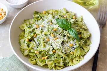 Farfalle pasta with pesto sauce. Healthy eating. Vegetarian food.