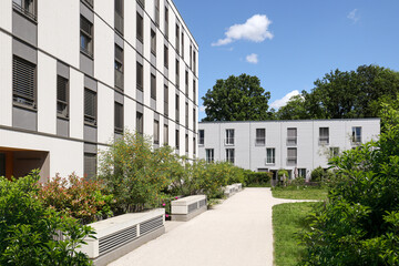 Residential area with ecological and sustainable green residential buildings, low-energy houses with apartments and green courtyard
