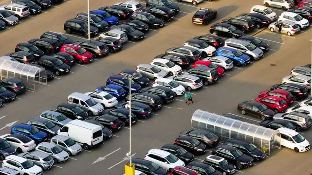 Aerial top view of the supermarket mall parking lot. Aerial view of vehicles in the parking lot. 