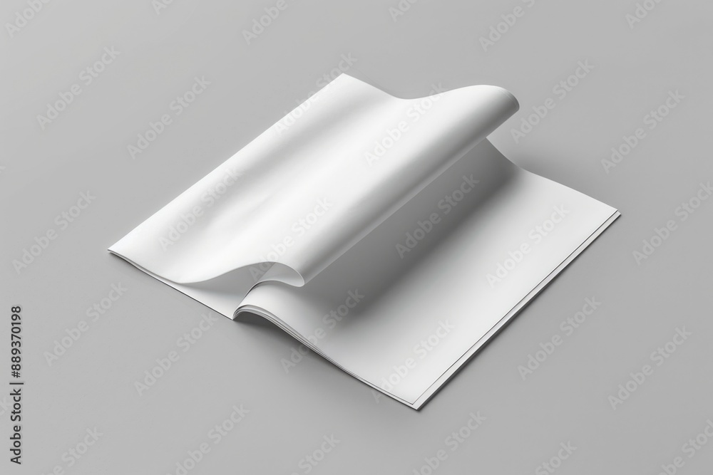 Poster a simple design featuring a folded white paper on a gray surface