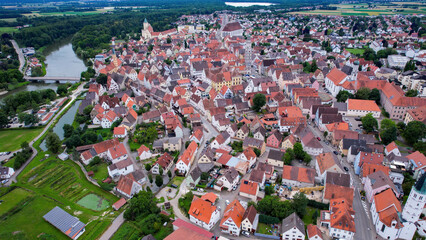 Aerial panorama around the old town of the city Lauingen during an overcast summer day in Bavaria.