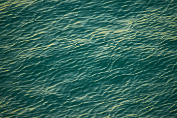 Sea water surface, wave texture. Calm seascape. The background of the blue waters of the sea. Background sea calm water.