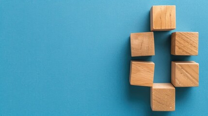 Symbolic Storytelling with Wooden Blocks on Blue Background for Business Concept