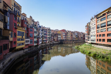 Girona, Spain - 18 July, 2024: Colorful buildings along the River Onyar, Girona, Catalonia