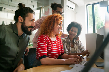 Group of business people and software developers working as a team in office
