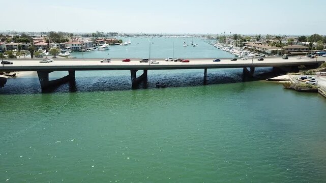 Aerial footage of Pacific Coast Hwy and the Pacific Ocean in Newport Beach, California USA 