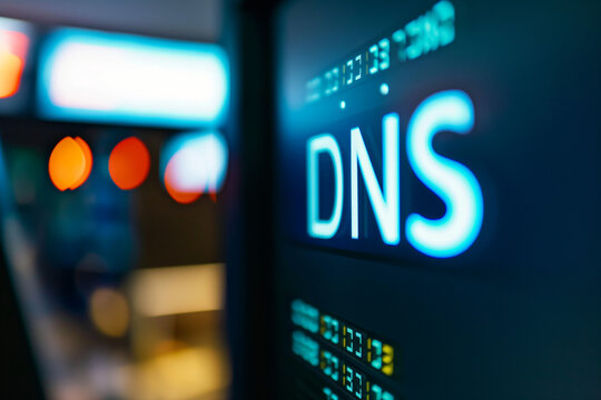 Macro shot of a computer screen displaying DNS text with bright lighting