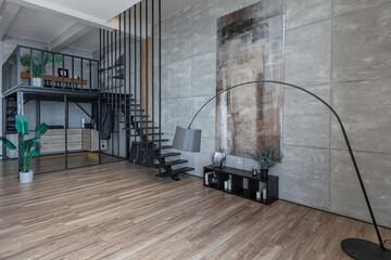 stylish minimalistic restrained modern interior of a two-storey apartment without people in the...