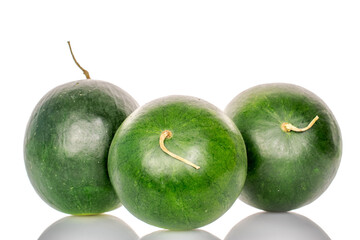 Three ripe sweet watermelons, macro, isolated on white background.