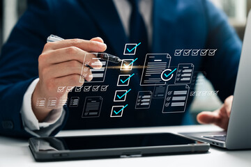 Business performance checklist and tracking, businessman using laptop and tablet Take online...