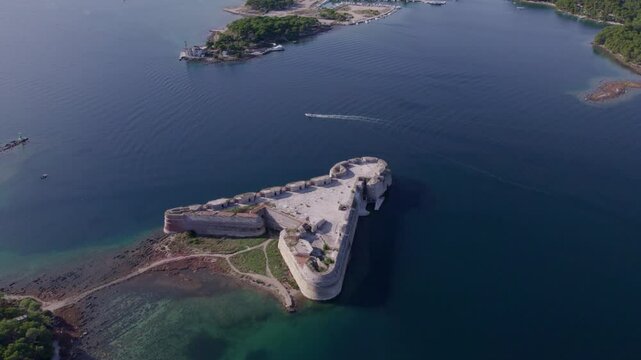 Aerial view of St. Nicholas fortress, canal, and Adriatic sea, Zablace, Croatia.