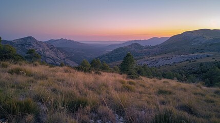 Beautiful mountainous landscape at sunrise, highlighting the natural beauty and tranquility of the scene.