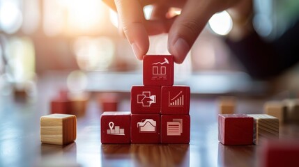 hands holding red cubes