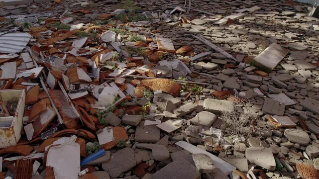 Aerial view of abandoned swimming pool with broken tiles and debris, Kupari, Dubrovnik-Neretva, Croatia.