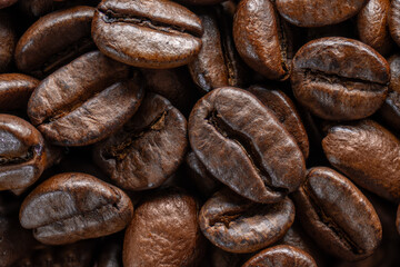 Group of roasted coffee beans close up top view