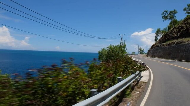 Stunning view of the sea and hill along the road trip in Manatuto - Timor Leste.