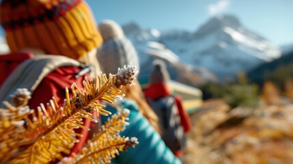 Fototapeta premium A group of hikers, dressed in colorful winter gear, make their way through a stunning snowy mountain landscape, showcasing both the beauty and challenge of winter exploration.