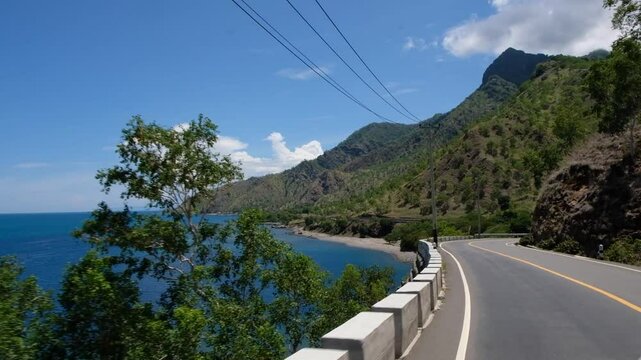 Stunning view of the sea and hill along the road trip in Manatuto - Timor Leste.